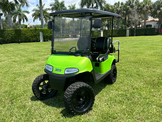 Cutting Edge Golf Carts - 2021 Lamborghini Green E-Z-GO Elite Lithium 48V RXV in Fort Lauderdale, FL. Jakes 6" Lift, custom SS rims, 84" top, deluxe lights, tinted windshield, seatbelts.