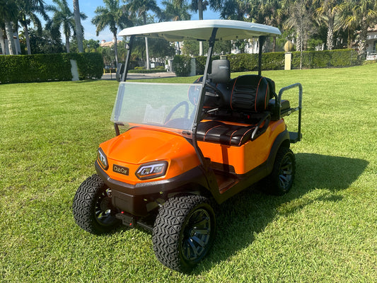 Cutting Edge Golf Carts - 2020 Lamborghini Orange Club Car Tempo in Fort Lauderdale, FL. MadJax 6" lift, custom leather seats, rear fold-down backseat, 14" Modz wheels, 23" AT tires, MadJax Lux lights, RGB running lights, seatbelts, LED mirrors.