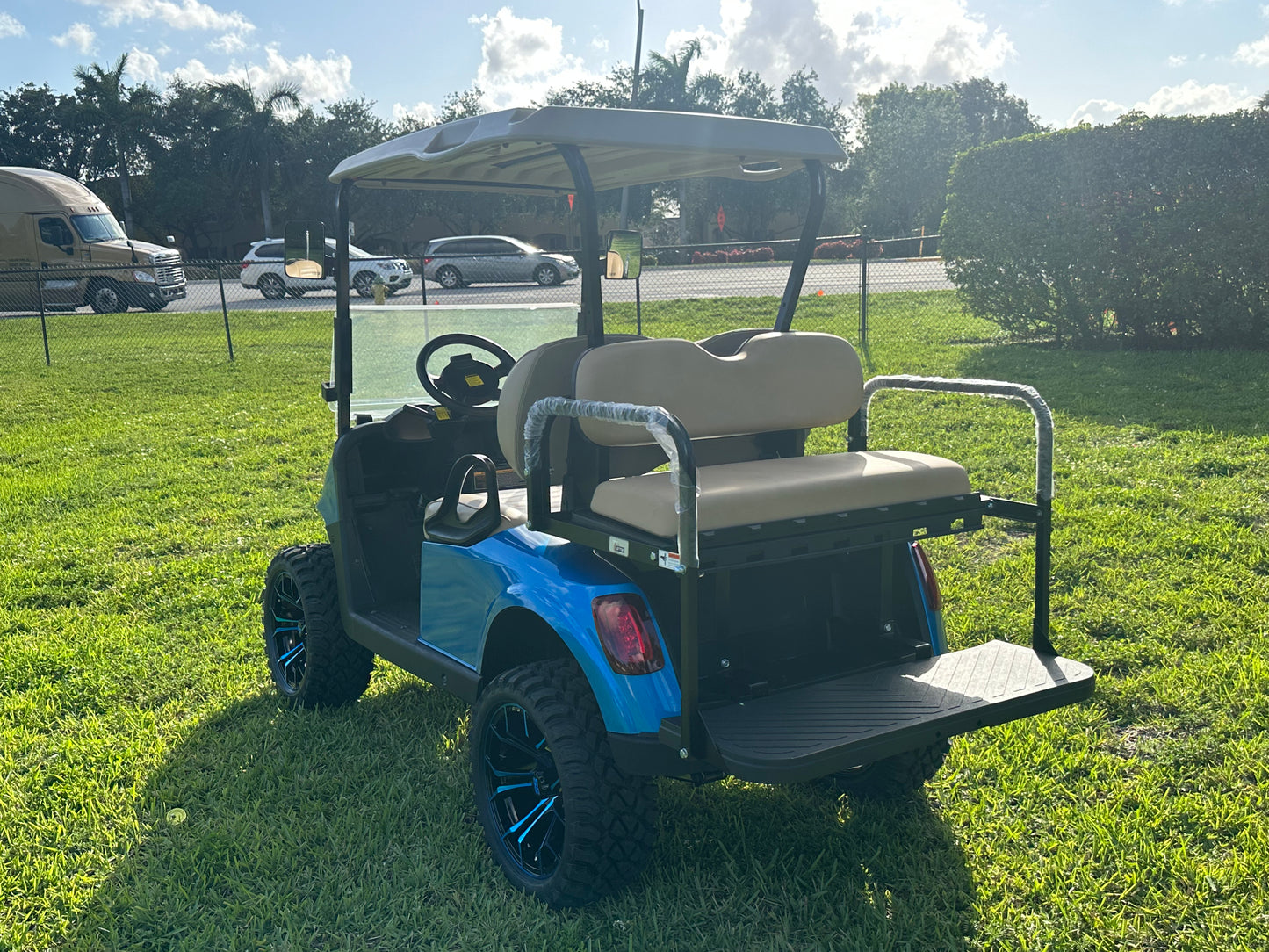 Cutting Edge Golf Carts - 2020 E-Z-GO RXV in Fort Lauderdale, FL. Brilliant blue paint, 4" lift kit, 15"x23" all-terrain wheels, fold-down backseat, deluxe light package with turn signals and horn. Style, performance, and practicality combined.
