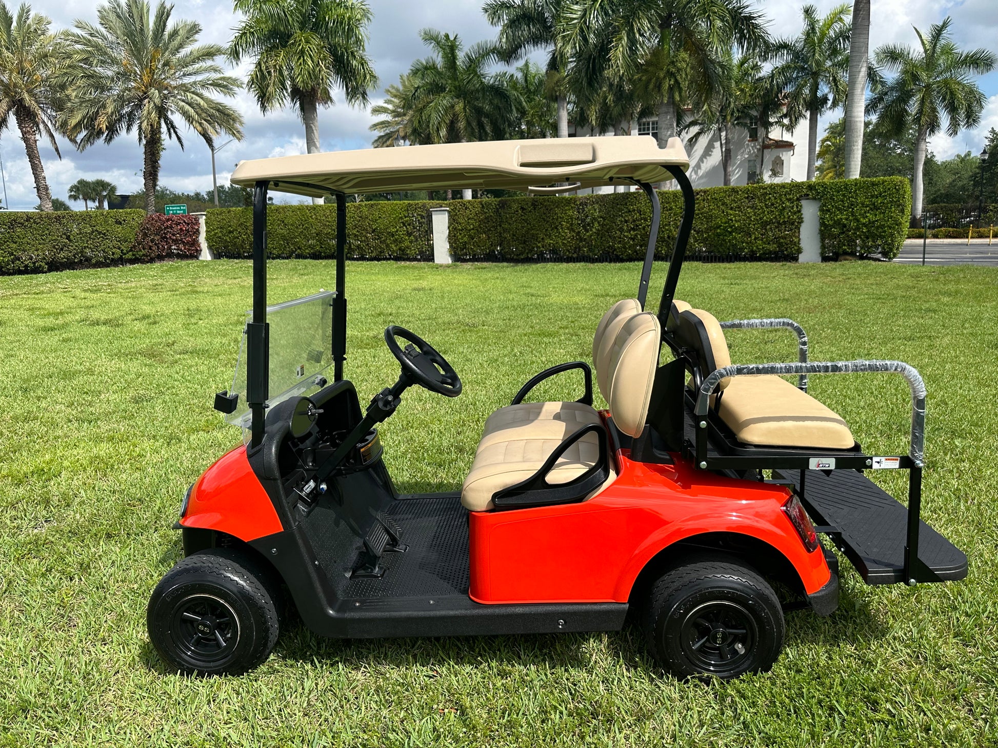 Cutting Edge Golf Carts - Go Mango Orange EZGO RXV: AC Driven, 48V Trojan Batteries, Custom Style, Black Wheel Covers, Back Seat, Deluxe Light Kit - Signals, Brake Light & Horn