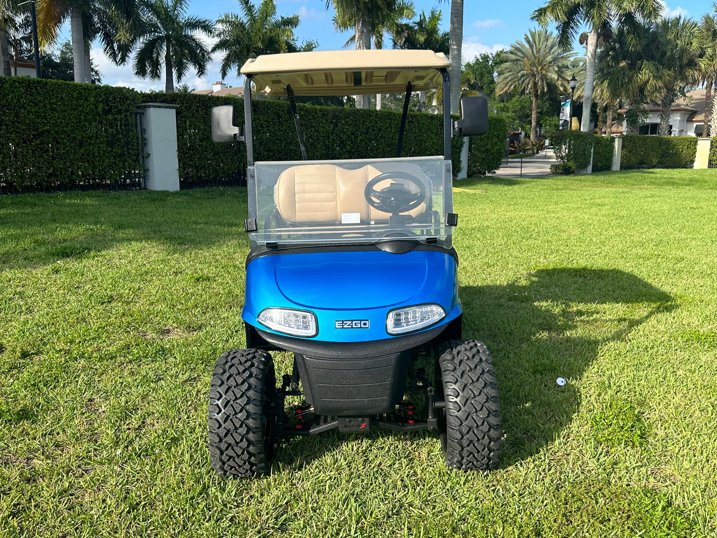 Cutting Edge Golf Carts - 2020 E-Z-GO RXV in Fort Lauderdale, FL. Brilliant blue paint, 4" lift kit, 15"x23" all-terrain wheels, fold-down backseat, deluxe light package with turn signals and horn. Style, performance, and practicality combined.