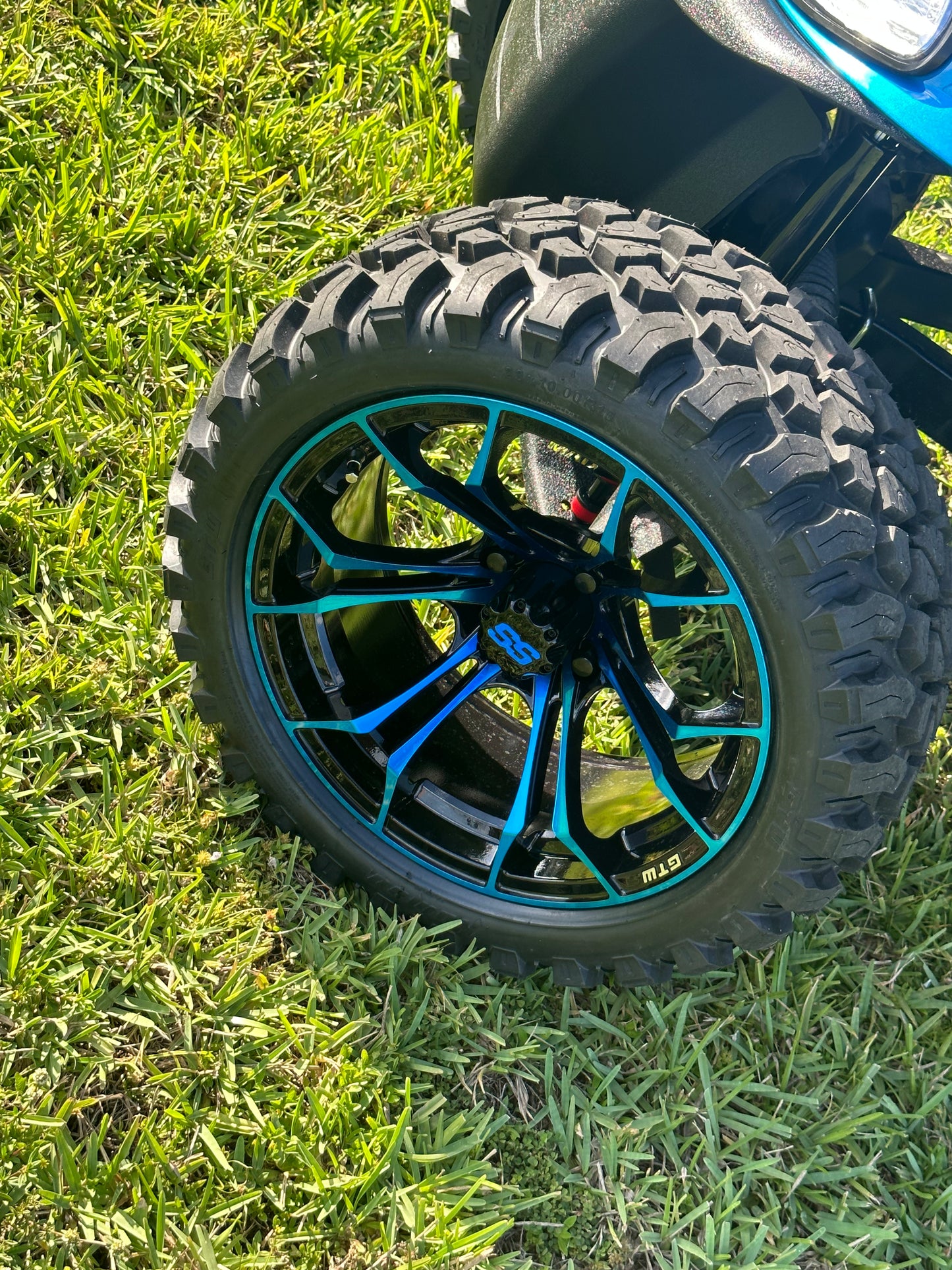 Cutting Edge Golf Carts - 2020 E-Z-GO RXV in Fort Lauderdale, FL. Brilliant blue paint, 4" lift kit, 15"x23" all-terrain wheels, fold-down backseat, deluxe light package with turn signals and horn. Style, performance, and practicality combined.