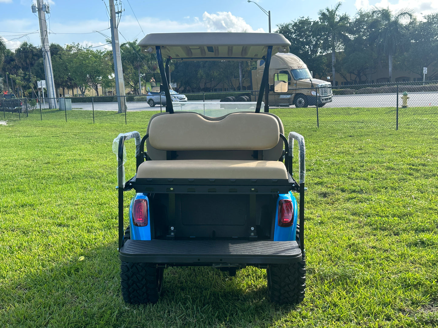 Cutting Edge Golf Carts - 2020 E-Z-GO RXV in Fort Lauderdale, FL. Brilliant blue paint, 4" lift kit, 15"x23" all-terrain wheels, fold-down backseat, deluxe light package with turn signals and horn. Style, performance, and practicality combined.
