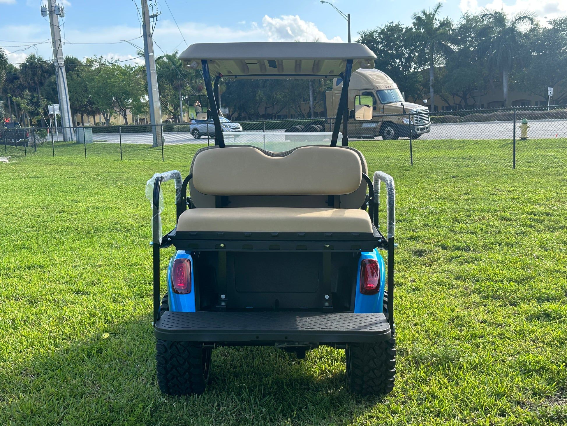Cutting Edge Golf Carts - 2020 E-Z-GO RXV in Fort Lauderdale, FL. Brilliant blue paint, 4" lift kit, 15"x23" all-terrain wheels, fold-down backseat, deluxe light package with turn signals and horn. Style, performance, and practicality combined.