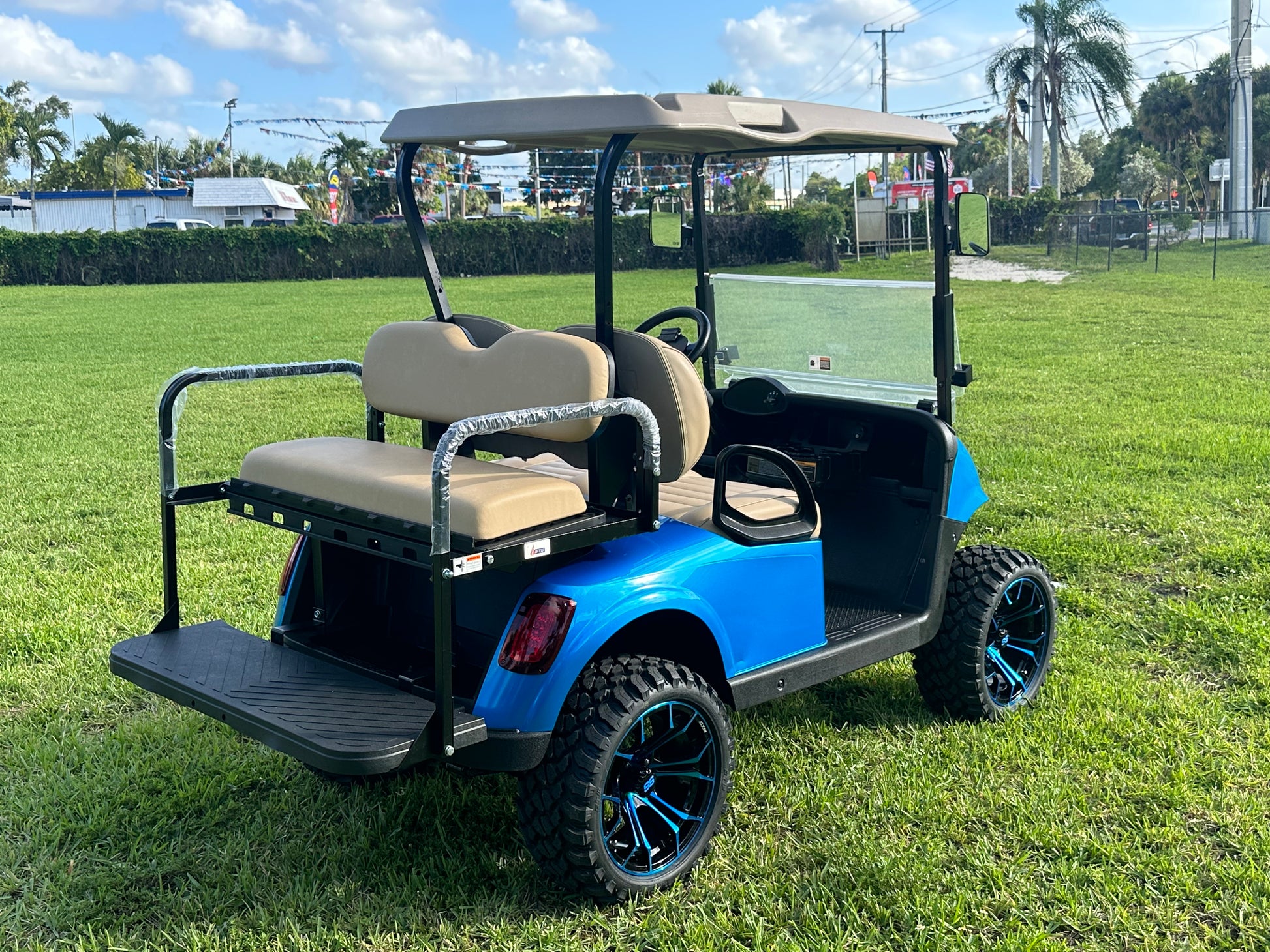 Cutting Edge Golf Carts - 2020 E-Z-GO RXV in Fort Lauderdale, FL. Brilliant blue paint, 4" lift kit, 15"x23" all-terrain wheels, fold-down backseat, deluxe light package with turn signals and horn. Style, performance, and practicality combined.