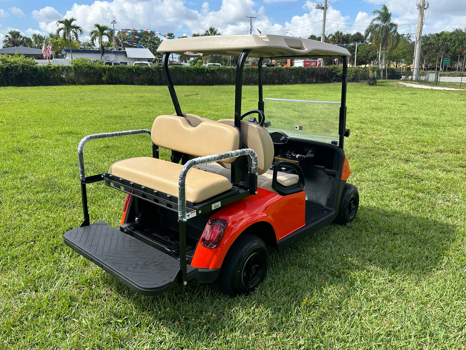 Cutting Edge Golf Carts - Go Mango Orange EZGO RXV: AC Driven, 48V Trojan Batteries, Custom Style, Black Wheel Covers, Back Seat, Deluxe Light Kit - Signals, Brake Light & Horn