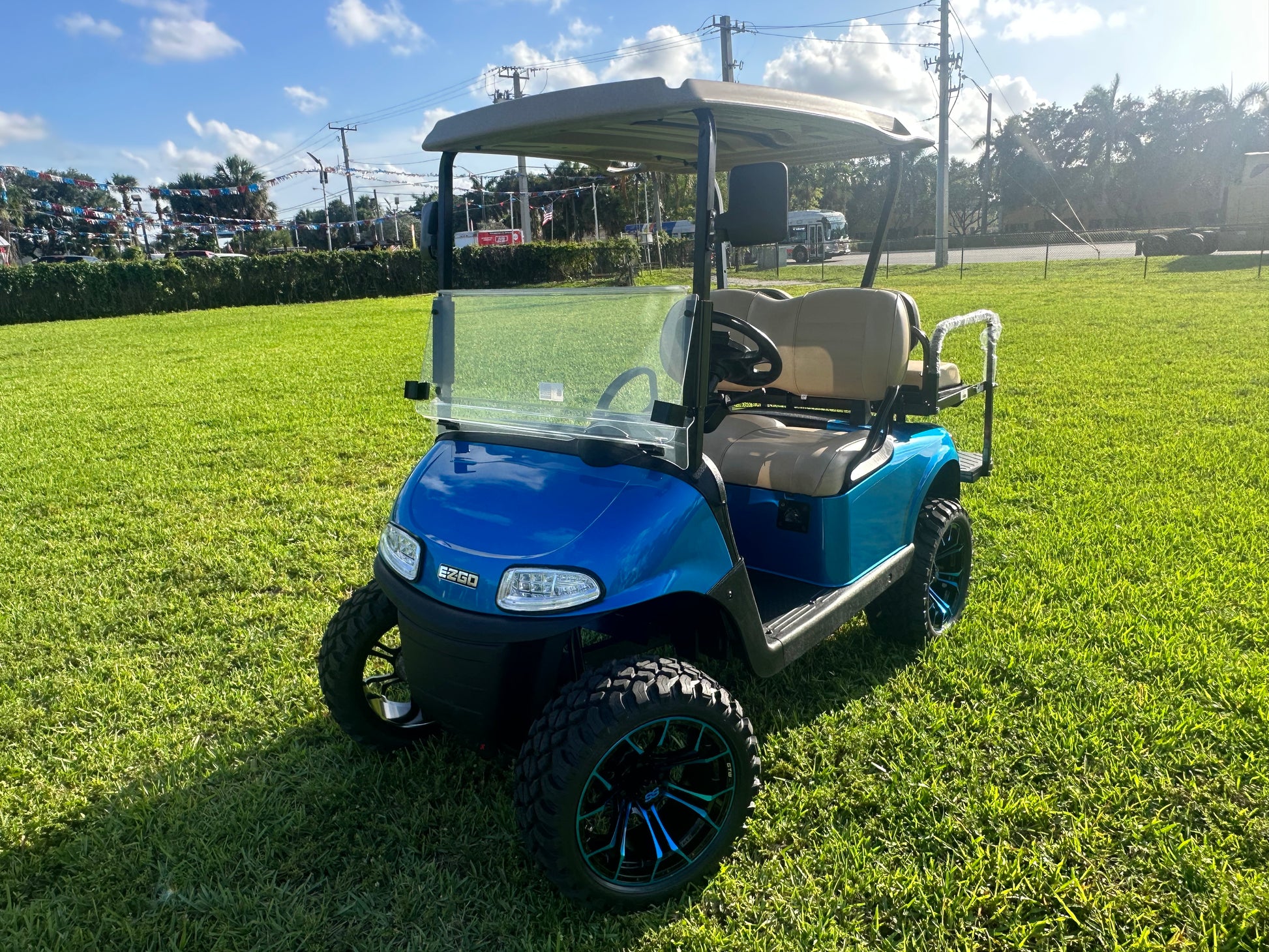 Cutting Edge Golf Carts - 2020 E-Z-GO RXV in Fort Lauderdale, FL. Brilliant blue paint, 4" lift kit, 15"x23" all-terrain wheels, fold-down backseat, deluxe light package with turn signals and horn. Style, performance, and practicality combined.