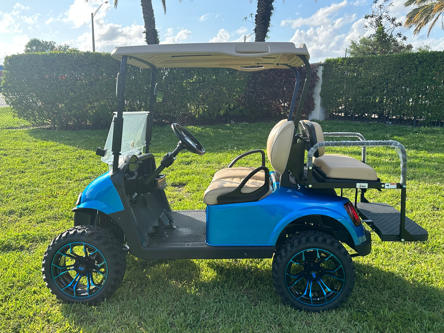Cutting Edge Golf Carts - 2020 E-Z-GO RXV in Fort Lauderdale, FL. Brilliant blue paint, 4" lift kit, 15"x23" all-terrain wheels, fold-down backseat, deluxe light package with turn signals and horn. Style, performance, and practicality combined.