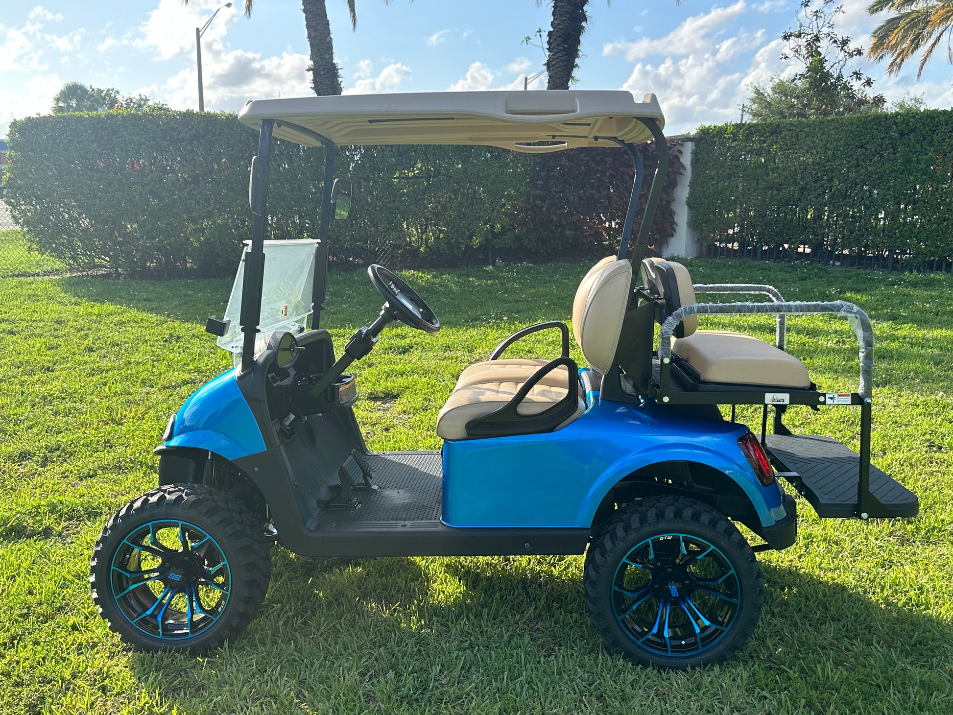 Cutting Edge Golf Carts - 2020 E-Z-GO RXV in Fort Lauderdale, FL. Brilliant blue paint, 4" lift kit, 15"x23" all-terrain wheels, fold-down backseat, deluxe light package with turn signals and horn. Style, performance, and practicality combined.