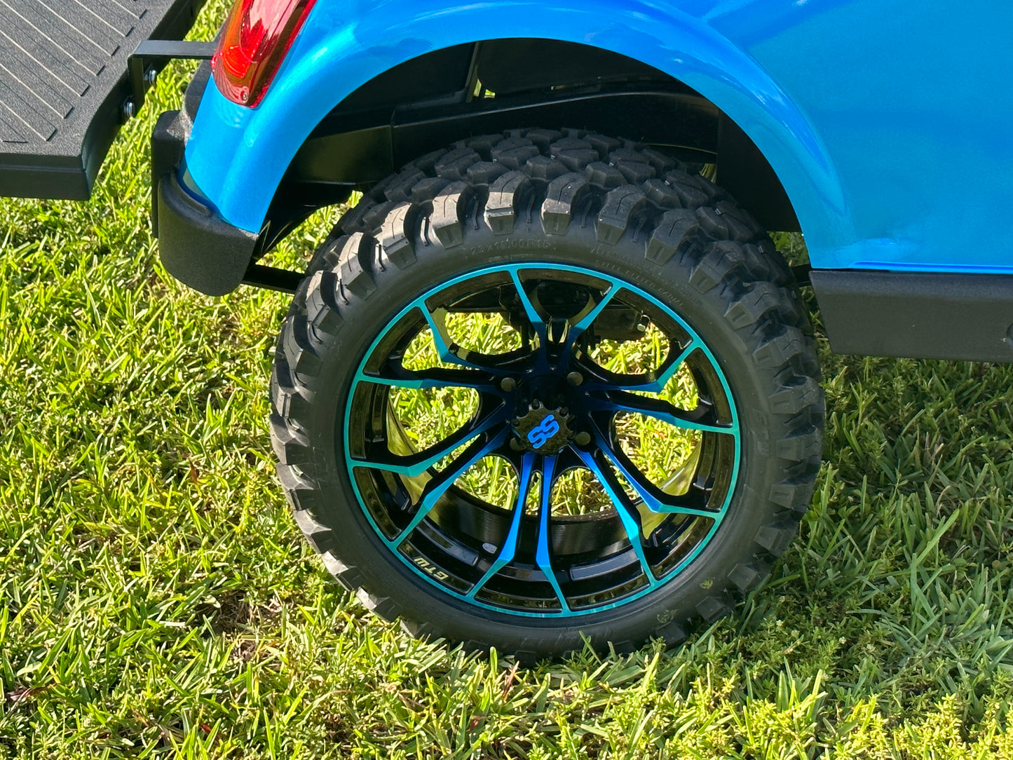 Cutting Edge Golf Carts - 2020 E-Z-GO RXV in Fort Lauderdale, FL. Brilliant blue paint, 4" lift kit, 15"x23" all-terrain wheels, fold-down backseat, deluxe light package with turn signals and horn. Style, performance, and practicality combined.