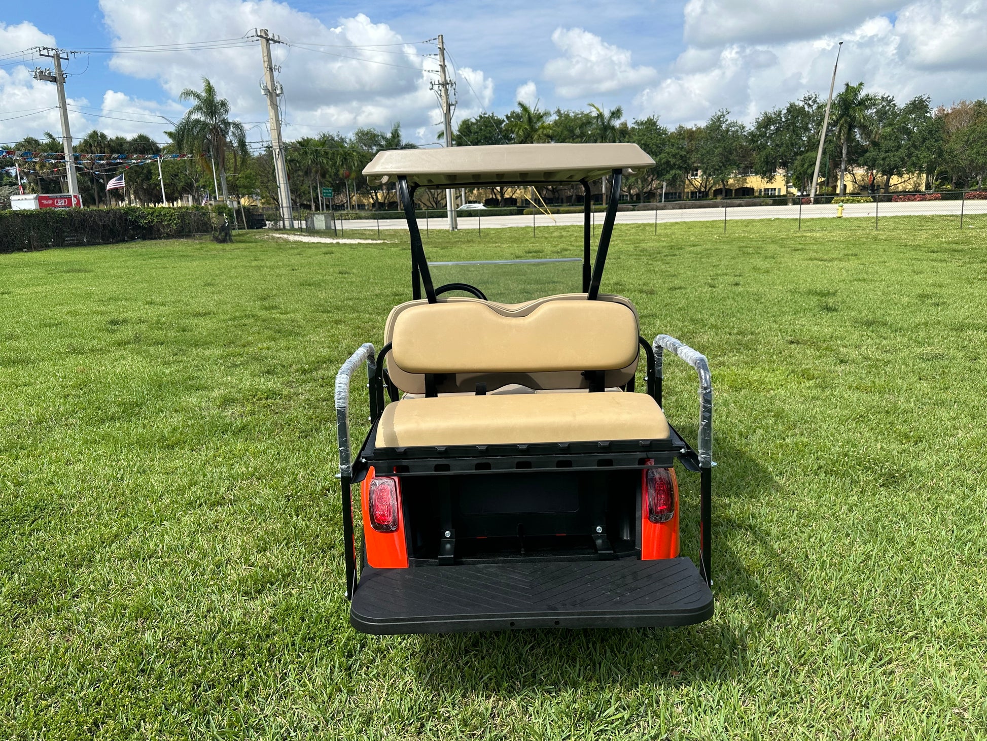 Cutting Edge Golf Carts - Go Mango Orange EZGO RXV: AC Driven, 48V Trojan Batteries, Custom Style, Black Wheel Covers, Back Seat, Deluxe Light Kit - Signals, Brake Light & Horn