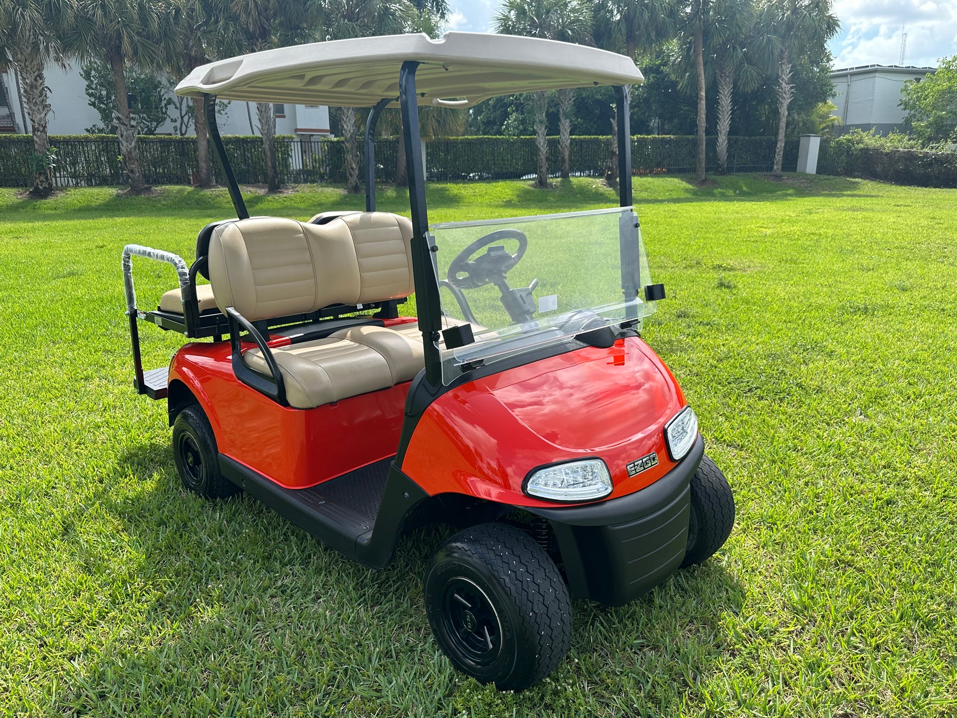 Cutting Edge Golf Carts - Go Mango Orange EZGO RXV: AC Driven, 48V Trojan Batteries, Custom Style, Black Wheel Covers, Back Seat, Deluxe Light Kit - Signals, Brake Light & Horn