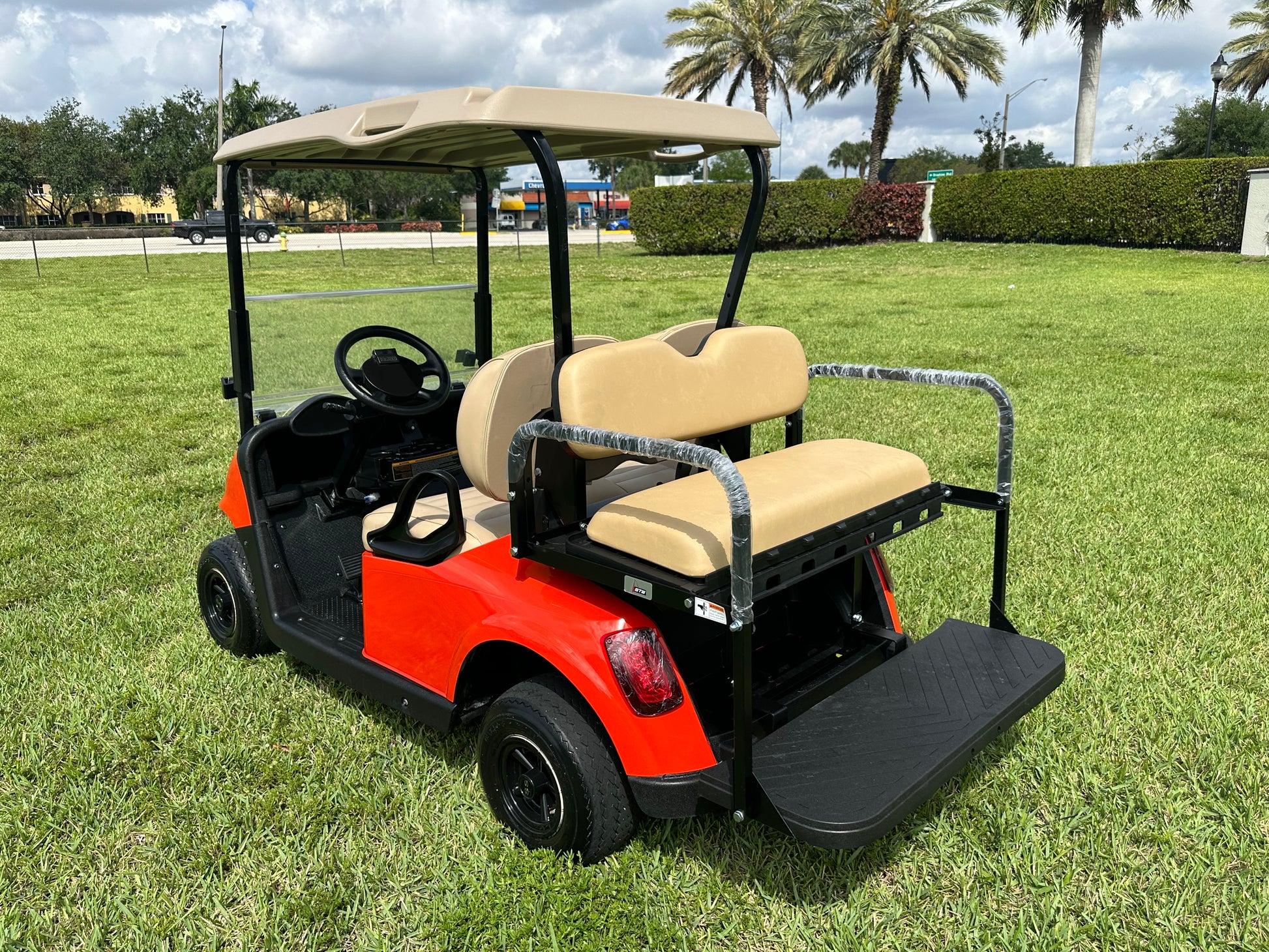 Cutting Edge Golf Carts - Go Mango Orange EZGO RXV: AC Driven, 48V Trojan Batteries, Custom Style, Black Wheel Covers, Back Seat, Deluxe Light Kit - Signals, Brake Light & Horn