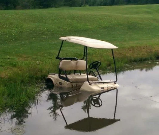flooded golf cart in pond