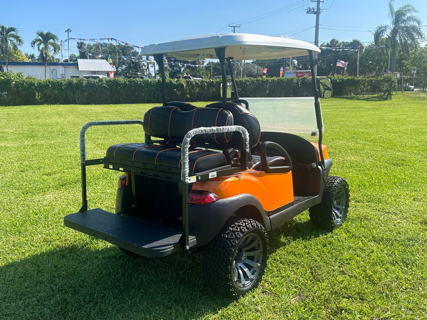 Cutting Edge Golf Carts - 2020 Lamborghini Orange Club Car Tempo in Fort Lauderdale, FL. MadJax 6" lift, custom leather seats, rear fold-down backseat, 14" Modz wheels, 23" AT tires, MadJax Lux lights, RGB running lights, seatbelts, LED mirrors.



