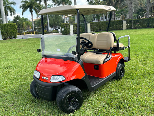 Cutting Edge Golf Carts - Go Mango Orange EZGO RXV: AC Driven, 48V Trojan Batteries, Custom Style, Black Wheel Covers, Back Seat, Deluxe Light Kit - Signals, Brake Light & Horn