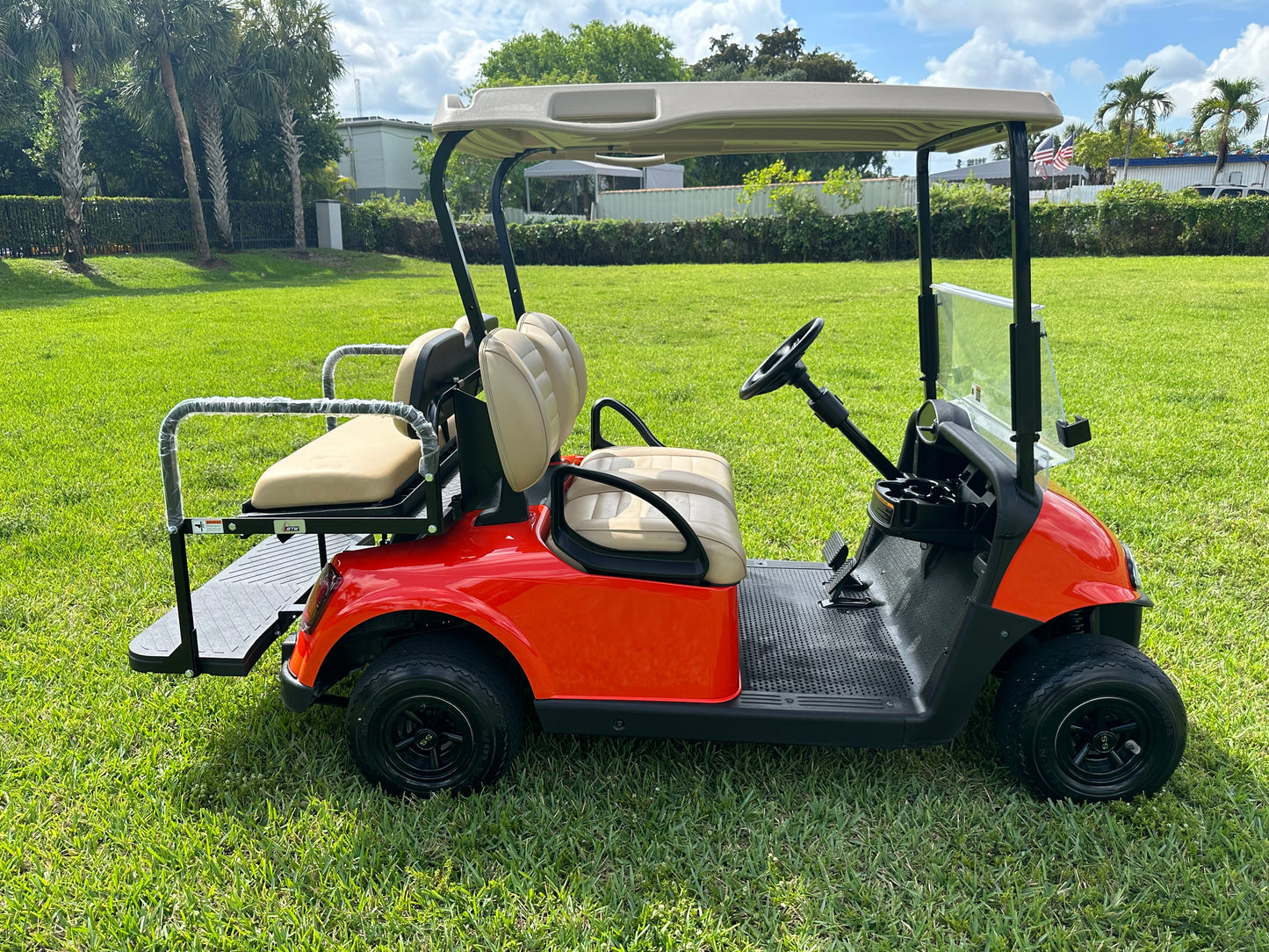 Cutting Edge Golf Carts - Go Mango Orange EZGO RXV: AC Driven, 48V Trojan Batteries, Custom Style, Black Wheel Covers, Back Seat, Deluxe Light Kit - Signals, Brake Light & Horn