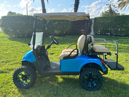 Cutting Edge Golf Carts - 2020 E-Z-GO RXV in Fort Lauderdale, FL. Brilliant blue paint, 4" lift kit, 15"x23" all-terrain wheels, fold-down backseat, deluxe light package with turn signals and horn. Style, performance, and practicality combined.




